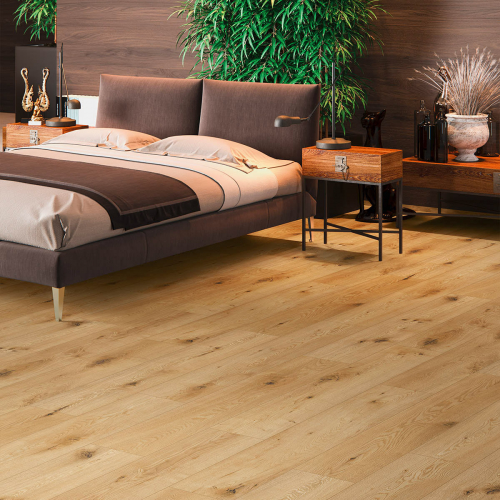 a bedroom with a bed and a table and plants